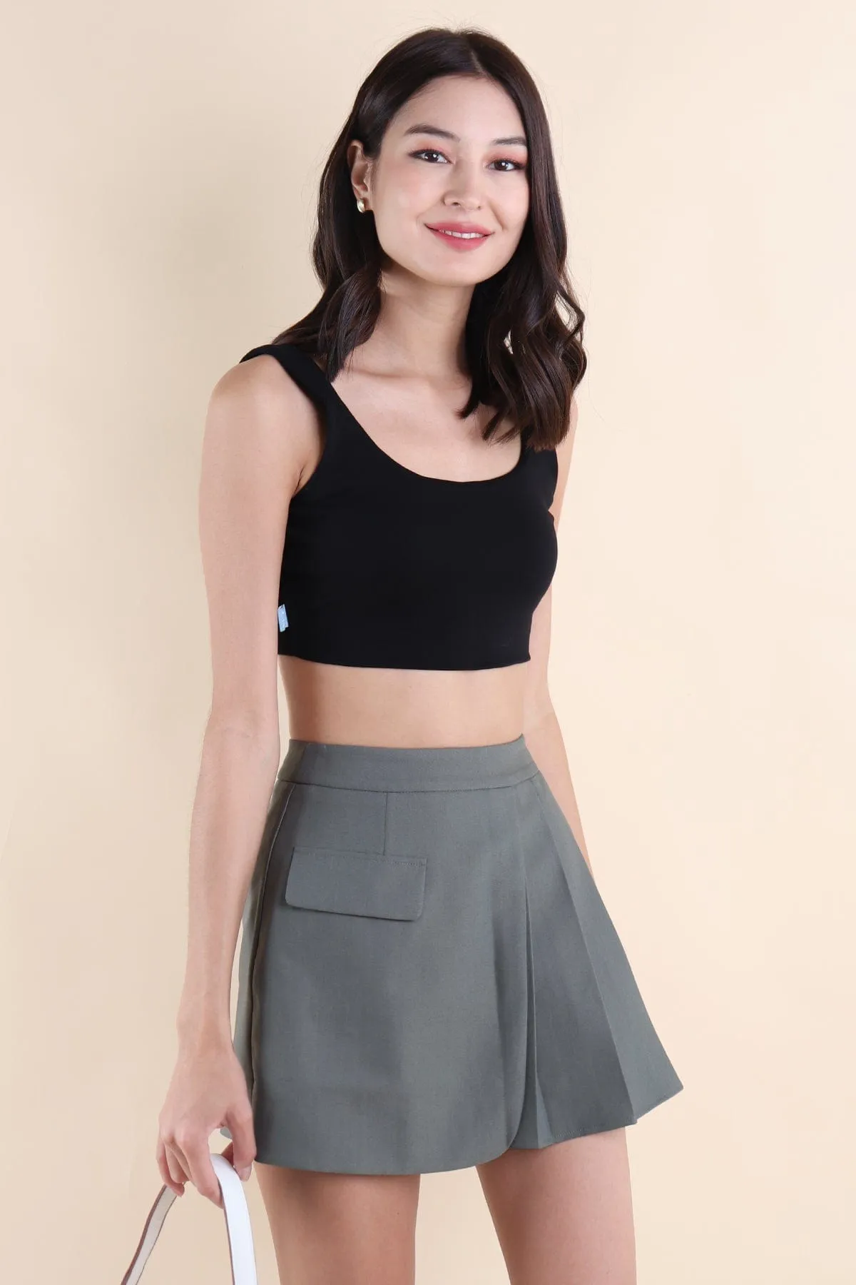 KERRI PLEATED SKIRT IN STONE GREEN